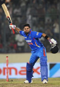 Indian batsman Virat Kholi reacts after scoring a century (100 runs) during the one day international (ODI) Asia Cup cricket match between India and Pakistan at The Sher-e-Bangla National Cricket Stadium in Dhaka on March 18, 2012. (AFP/Getty Images) Indian batsman Virat Kholi reacts after scoring a century (100 runs) during the one day international (ODI) Asia Cup cricket match between India and Pakistan at The Sher-e-Bangla National Cricket Stadium in Dhaka on March 18, 2012. (AFP/Getty Images)