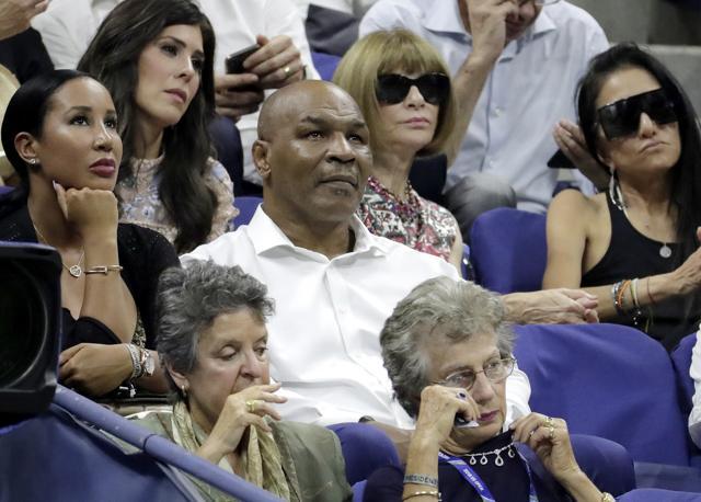 Former boxer Mike Tyson (centre) at the US Open tennis tournament on August 27, 2018 in New York. (AP)