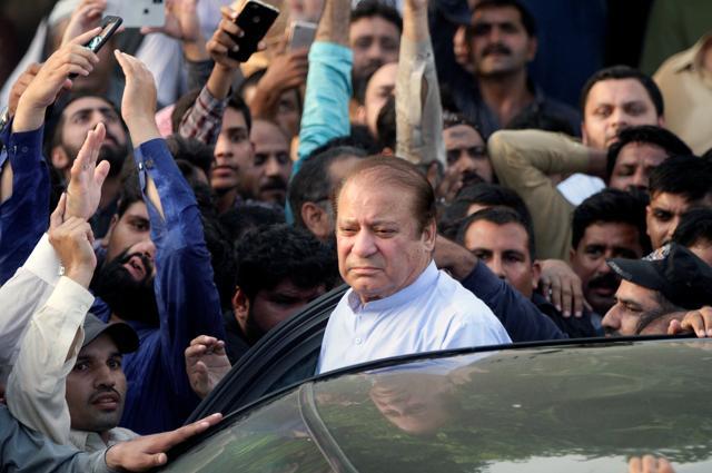 Former Prime Minister Nawaz Sharif, who was temporarily released from prison, arrives to attend funeral services for his wife, Kulsoom, in Lahore. (Reuters Photo) Former Prime Minister Nawaz Sharif, who was temporarily released from prison, arrives to attend funeral services for his wife, Kulsoom, in Lahore. (Reuters Photo)