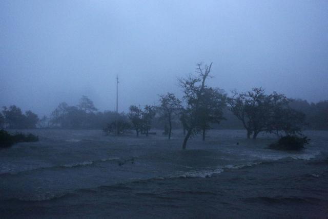 Before sunrise, high winds and storm surge from Hurricane Florence hits Swansboro N.C. on September 14. (AP Photo) Before sunrise, high winds and storm surge from Hurricane Florence hits Swansboro N.C. on September 14. (AP Photo)