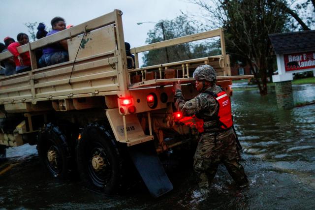 People being rescued by the US Army, in New Bern, North Carolina. (Reuters) People being rescued by the US Army, in New Bern, North Carolina. (Reuters)