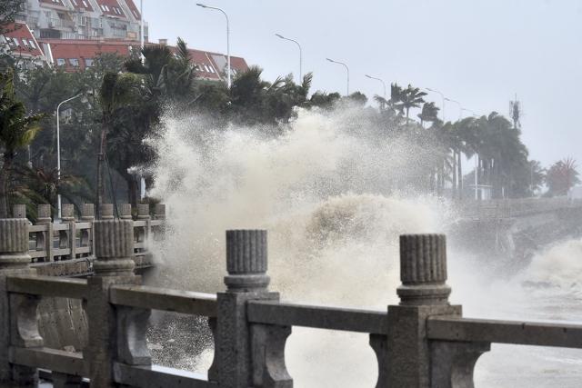 In this photo released by Xinhua News Agency, waves crash onto the coastline in Zhuhai in southern China's Guangdong Province on Sunday, Sept. 16, 2018. (AP Photo) In this photo released by Xinhua News Agency, waves crash onto the coastline in Zhuhai in southern China's Guangdong Province on Sunday, Sept. 16, 2018. (AP Photo)