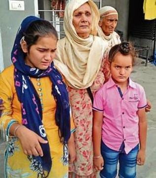 Kashmir Kaur, mother of late Havildar Hardeep Singh, with his children at Harike Pattan in Tarn Taran.
