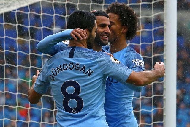 Manchester City's Riyad Mahrez (C) celebrates with Ilkay Gundogan (L) and Leroy Sane. (AFP) Manchester City's Riyad Mahrez (C) celebrates with Ilkay Gundogan (L) and Leroy Sane. (AFP)