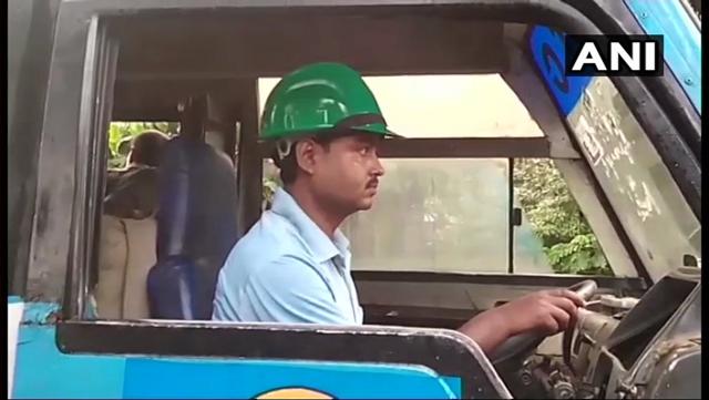 Drivers of government-owned buses in Cooch Behar were seen wearing helmets during the 12-hour bandh in West Bengal on Wednesday. (ANI photo) Drivers of government-owned buses in Cooch Behar were seen wearing helmets during the 12-hour bandh in West Bengal on Wednesday. (ANI photo)