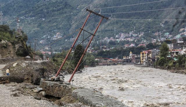 An electric pole on the bank of the swollen River Beas stands tilted after incessant rains, in Kullu, Himachal Pradesh, Tuesday, Sep 25, 2018. (PTI) An electric pole on the bank of the swollen River Beas stands tilted after incessant rains, in Kullu, Himachal Pradesh, Tuesday, Sep 25, 2018. (PTI)