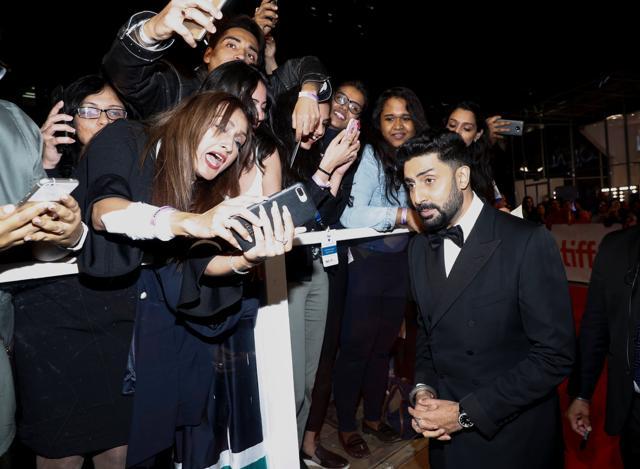 Actor Abhishek Bachchan poses with fans as he arrives for the premiere of Husband Material at the Toronto International Film Festival in Toronto, Ontario, Canada, September 11, 2018. (REUTERS) Actor Abhishek Bachchan poses with fans as he arrives for the premiere of Husband Material at the Toronto International Film Festival in Toronto, Ontario, Canada, September 11, 2018. (REUTERS)