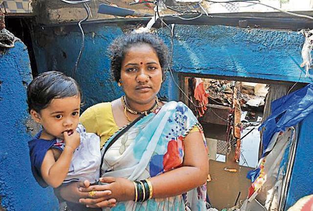 It was the worst hour of my life. I was sitting on a tin roof, holding my small daughter and paralytic husband. Our home was destroyed in front of our eyes and I was worried about my son, who was at school. Everything was carried into the nalah, says Archana Dhimdhime, PMC sweeper, flood-affected resident (HT PHOTO)