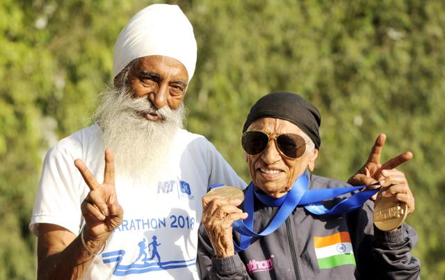 Mann Kaur, 102, with her son Gurdev Singh, 80, at Punjabi University in Patiala. Kaur, who took baby steps into the world of sports at the age of 93, says age is never a barrier. (Bharat Bhushan /ht) Mann Kaur, 102, with her son Gurdev Singh, 80, at Punjabi University in Patiala. Kaur, who took baby steps into the world of sports at the age of 93, says age is never a barrier. (Bharat Bhushan /ht)