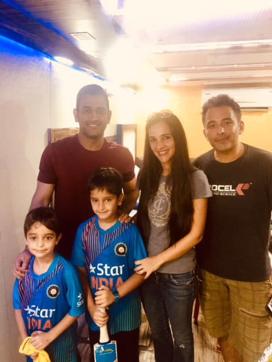 MS Dhoni with the Salujas. MS Dhoni with the Salujas.