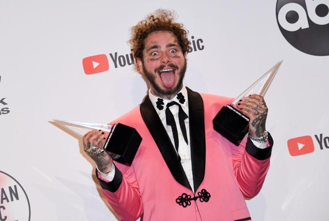 Post Malone poses with his trophies. He won the Best male artist (pop/rock) at the American Music Awards. (AFP) Post Malone poses with his trophies. He won the Best male artist (pop/rock) at the American Music Awards. (AFP)