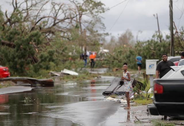 Tamiya Waldon looks out at the damage to her neighborhood in the aftermath of Hurricane Michael in Panama City, Fla., Wednesday, Oct. 10, 2018. (AP) Tamiya Waldon looks out at the damage to her neighborhood in the aftermath of Hurricane Michael in Panama City, Fla., Wednesday, Oct. 10, 2018. (AP)