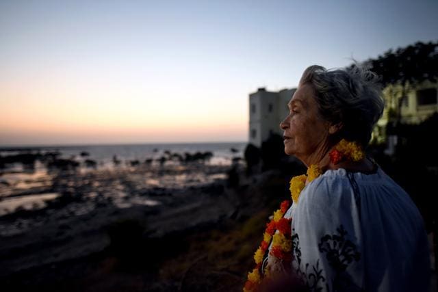 Josephine Nowicka Salva, a former nurse, near the Maharaja’s palace at the Balachadi beach. One week after her visit, she passed away in the USA. (Amal KS/HT PHOTO)