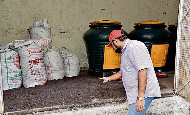 A resident at the compost room of Palash co-operative housing society in Wakad, Pune. (HT PHOTO) A resident at the compost room of Palash co-operative housing society in Wakad, Pune. (HT PHOTO)