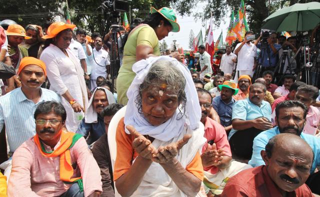 Devotees take part in a protest against the Supreme Court verdict in Thiruvananthapuram on Monday. (AFP Photo) Devotees take part in a protest against the Supreme Court verdict in Thiruvananthapuram on Monday. (AFP Photo)