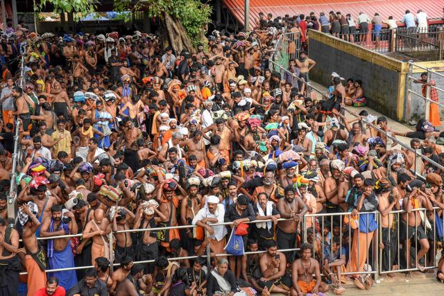 Devotees wait for opening of the Lord Ayyappa Temple in Sabarimala on Wednesday. (PTI Photo) Devotees wait for opening of the Lord Ayyappa Temple in Sabarimala on Wednesday. (PTI Photo)