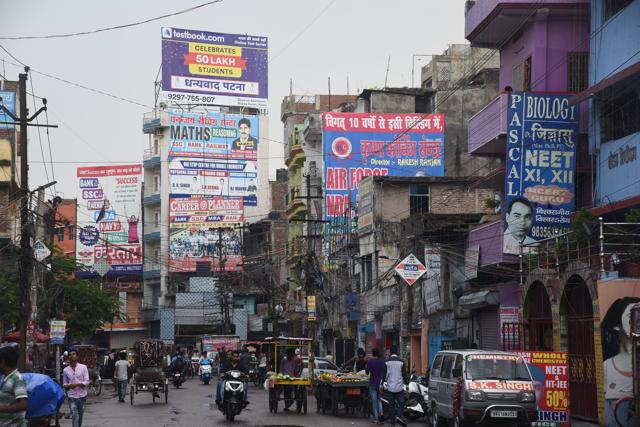 Hoardings loom over a street in Patna. (HT Photo)