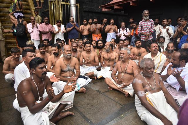 Sabarimala priests and temple staff join the protest against allowing menstruating women enter the Ayyappa temple, on October 19, 2018. In an unheard of occurrence, the priests boycotted rituals while the head priest threatened to close the temple doors and quit his position if women were allowed. (AP) Sabarimala priests and temple staff join the protest against allowing menstruating women enter the Ayyappa temple, on October 19, 2018. In an unheard of occurrence, the priests boycotted rituals while the head priest threatened to close the temple doors and quit his position if women were allowed. (AP)