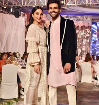 Kartik Aaryan and Kiara Advani walk the ramp.