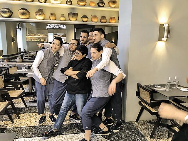 The chef with her team in Cittamani, Milan