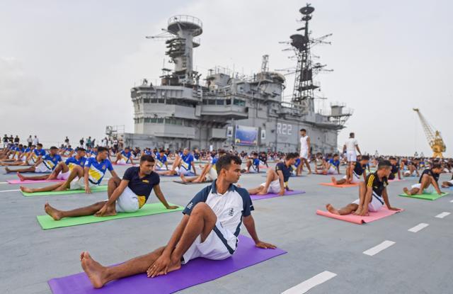 Indian Navy officials perform yoga on the flight deck of Indian Navy's decommissioned aircraft carrier 'Viraat' on the 4th International Yoga Day, in Mumbai, June 21, 2018. (PTI File ) Indian Navy officials perform yoga on the flight deck of Indian Navy's decommissioned aircraft carrier 'Viraat' on the 4th International Yoga Day, in Mumbai, June 21, 2018. (PTI File )