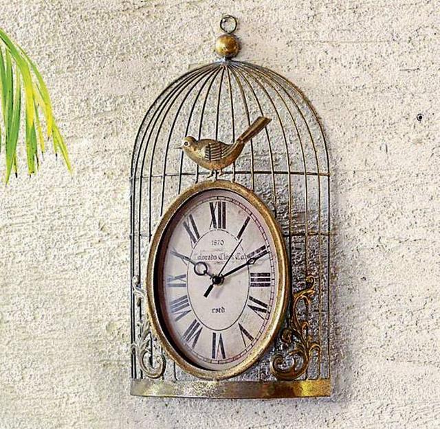 A gold/brass clock in antique finish can liven up any wall. (Courtesy: Mora Taara)