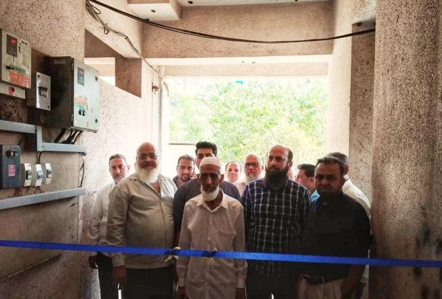 Members of the housing society chipped in with funds to install the power plant. (HT Photo ) Members of the housing society chipped in with funds to install the power plant. (HT Photo )