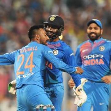 File - Indian cricketer Krunal Pandya (L) celebrates with teammates after taking a wicket (AFP)
