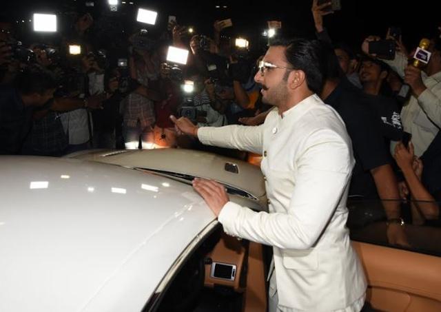 Ranveer Singh greets fans as he leaves India for wedding with Deepika Padukone.