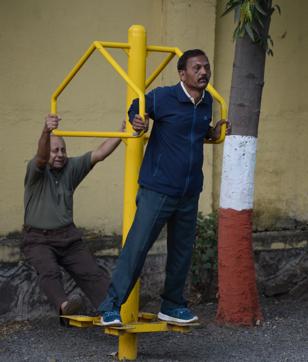 People using the simple machine exercises of stretching leg and hand machine (Milind Saurkar/HT Photo) People using the simple machine exercises of stretching leg and hand machine (Milind Saurkar/HT Photo)