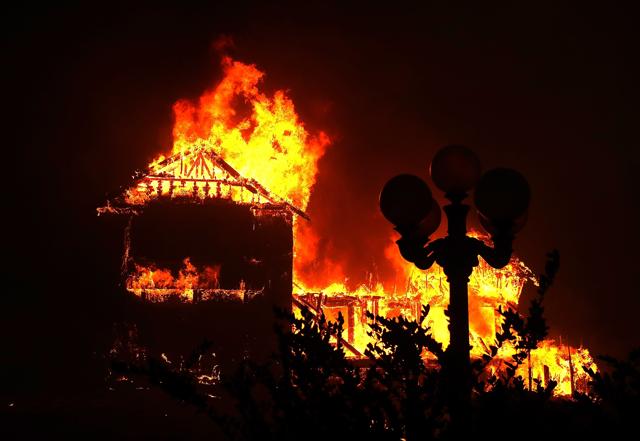A home burns as the Camp Fire moves through the area on November 8, 2018 in Paradise, California. (AFP file photo) A home burns as the Camp Fire moves through the area on November 8, 2018 in Paradise, California. (AFP file photo)