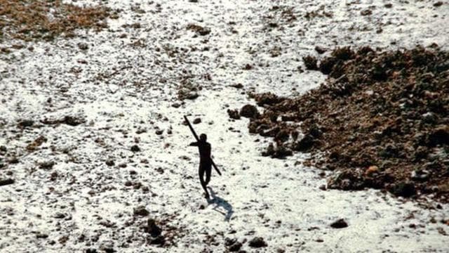 A member of the Sentinelese tribe photographed on a beach, shooting arrows at the Indian Coast Guard helicopter. (Photo: Indian Coast Guard/Survival International) A member of the Sentinelese tribe photographed on a beach, shooting arrows at the Indian Coast Guard helicopter. (Photo: Indian Coast Guard/Survival International)
