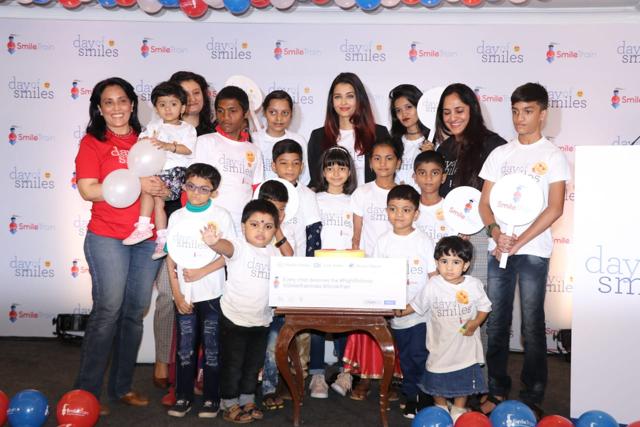Aishwarya and Aaradhya with the kids of Smile Foundation. Aishwarya and Aaradhya with the kids of Smile Foundation.