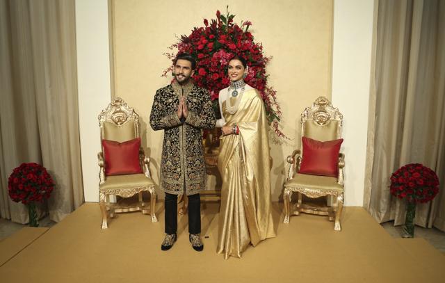 Deepika Padukone, right, and Ranveer Singh pose at their wedding reception. (AP) Deepika Padukone, right, and Ranveer Singh pose at their wedding reception. (AP)