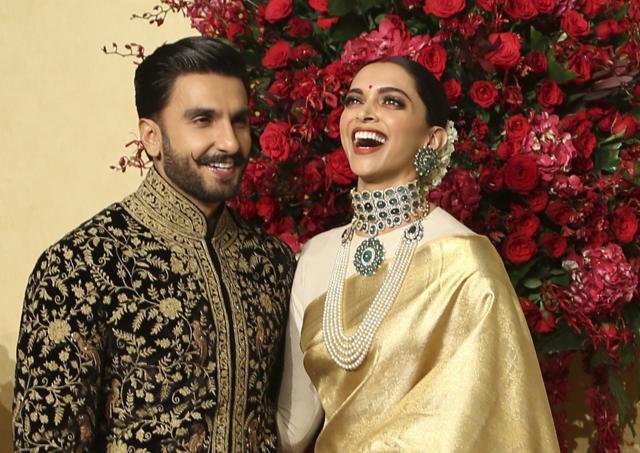 Deepika Padukone, right, laughs as she poses with her husband Ranveer Singh. (AP) Deepika Padukone, right, laughs as she poses with her husband Ranveer Singh. (AP)
