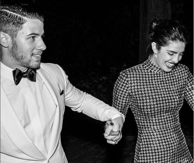 Nick Jonas and Priyanka Chopra at a fashion event.