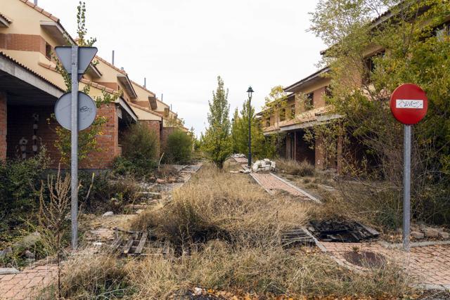 A road sign stand near abandoned and unfinished residential properties in Bernuy de Porreros, near Segovia, Spain (Bloomberg) A road sign stand near abandoned and unfinished residential properties in Bernuy de Porreros, near Segovia, Spain (Bloomberg)