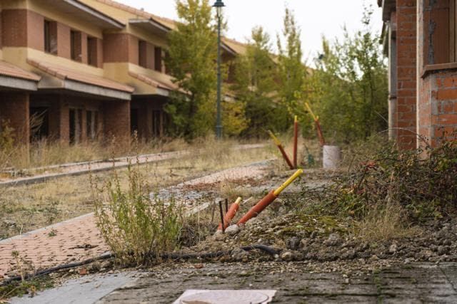 Pipes for electric cables come from the ground near abandoned and unfinished residential properties in Bernuy de Porreros, near Segovia, Spain (Bloomberg) Pipes for electric cables come from the ground near abandoned and unfinished residential properties in Bernuy de Porreros, near Segovia, Spain (Bloomberg)