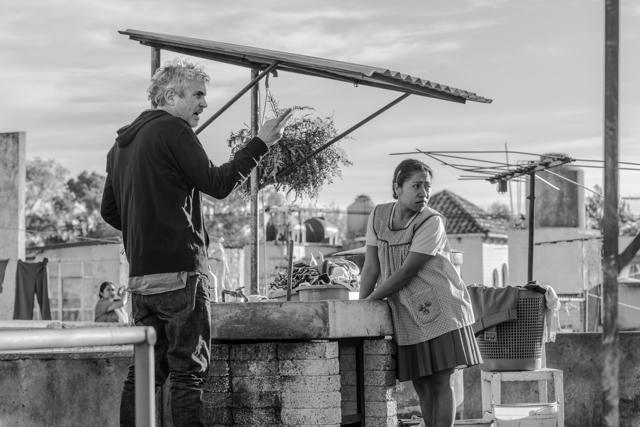 This image released by Netflix shows filmmaker Alfonso Cuaron, left, and actress Yalitza Aparicio on the set of Roma. (AP) This image released by Netflix shows filmmaker Alfonso Cuaron, left, and actress Yalitza Aparicio on the set of Roma. (AP)