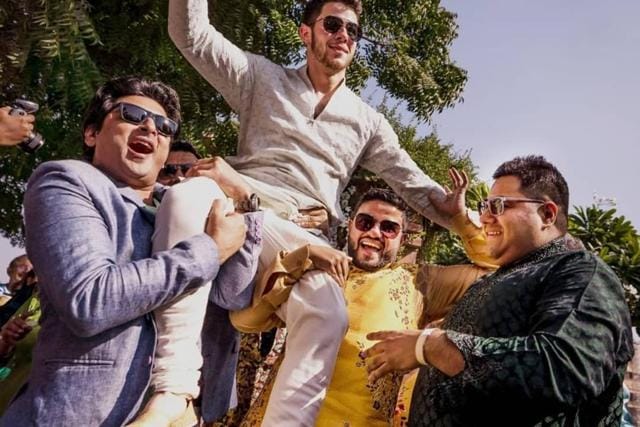 Priyanka Chopra’s brothers hold up Nick Jonas on their shoulders. Priyanka Chopra’s brothers hold up Nick Jonas on their shoulders.