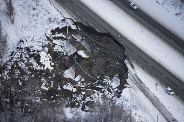 This aerial photo shows damage at the Glenn Highway near Mirror Lake after earthquakes in the Anchorage area, Alaska, Friday. (AP) This aerial photo shows damage at the Glenn Highway near Mirror Lake after earthquakes in the Anchorage area, Alaska, Friday. (AP)