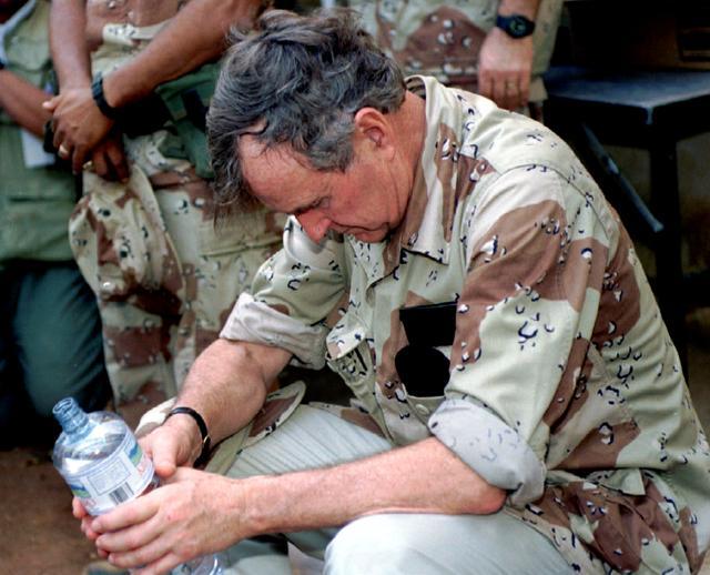 US President George H.W. Bush rests and holds a bottle of drinking water as he takes a pause while visiting US troops in Somalia January 2, 1993. (Reuters File Photo) US President George H.W. Bush rests and holds a bottle of drinking water as he takes a pause while visiting US troops in Somalia January 2, 1993. (Reuters File Photo)