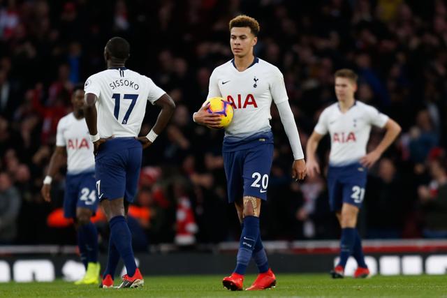 Tottenham Hotspur's English midfielder Dele Alli walks back to the centre circle. (AFP)