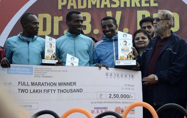 From left - Bekele Asefa, Besha Getachew, Zike Debebe winners of 33rd Pune International full (Men) Marathon receiving price by the hands of Suresh Kalmadi on Sunday. (Ravindra Joshi/HT PHOTO) From left - Bekele Asefa, Besha Getachew, Zike Debebe winners of 33rd Pune International full (Men) Marathon receiving price by the hands of Suresh Kalmadi on Sunday. (Ravindra Joshi/HT PHOTO)
