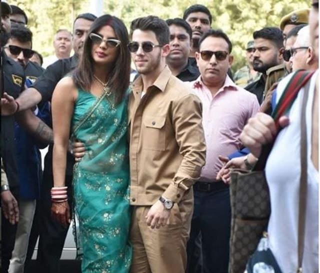 Priyanka Chopra with Nick Jonas at the Jodhpur airport. (Viral Bhayani)