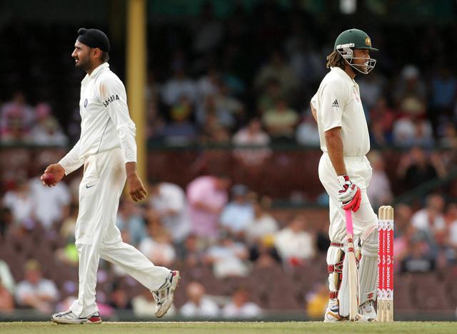 Harbhajan Singh of India walks past Andrew Symonds of Australia on his way back to his bowling mark during day four of the Second Test match between Australia and India at the Sydney Cricket Ground on January 5, 2008 in Sydney, Australia. (Photo by Ezra Shaw/Getty Images) (Getty Images) Harbhajan Singh of India walks past Andrew Symonds of Australia on his way back to his bowling mark during day four of the Second Test match between Australia and India at the Sydney Cricket Ground on January 5, 2008 in Sydney, Australia. (Photo by Ezra Shaw/Getty Images) (Getty Images)