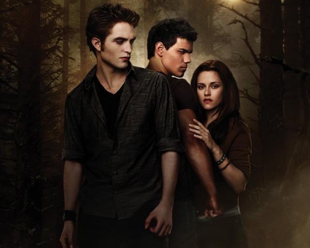 Kristen Stewart and Robert Pattinson - Edward and Bella - with Taylor Lautner, who played the werewolf Jacob, in New Moon. Kristen Stewart and Robert Pattinson - Edward and Bella - with Taylor Lautner, who played the werewolf Jacob, in New Moon.