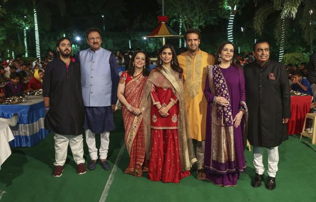 RIL chief Mukesh Ambani, wife Nita Ambani, son Anant Ambani with daughter Isha Ambani, fiance Anand Piramal, and in-laws, Ajay and Swati Piramal pose for a photo ahead of their daughter Isha's wedding, in Udaipur. (PTI Photo) RIL chief Mukesh Ambani, wife Nita Ambani, son Anant Ambani with daughter Isha Ambani, fiance Anand Piramal, and in-laws, Ajay and Swati Piramal pose for a photo ahead of their daughter Isha's wedding, in Udaipur. (PTI Photo)