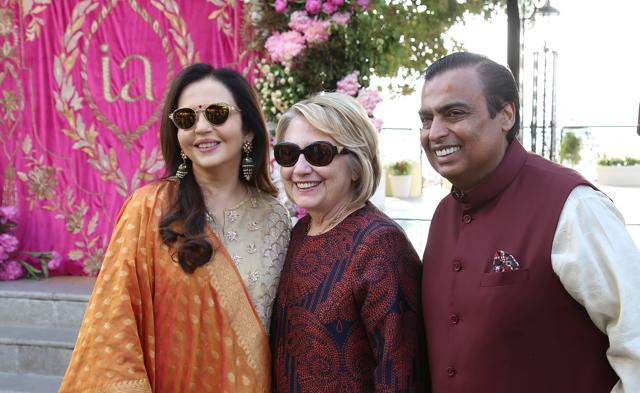 This handout photograph released on December 8, 2018 by Reliance Industries shows Reliance Industries chairman Mukesh Ambani (R) and his wife Nita receiving former US first lady Hillary Clinton (C), who arrived for the pre-wedding function of Mukesh's daughter Isha Ambani with Anand Piramal, in Udaipur. (AFP) This handout photograph released on December 8, 2018 by Reliance Industries shows Reliance Industries chairman Mukesh Ambani (R) and his wife Nita receiving former US first lady Hillary Clinton (C), who arrived for the pre-wedding function of Mukesh's daughter Isha Ambani with Anand Piramal, in Udaipur. (AFP)