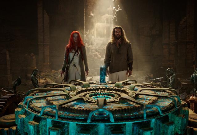This image released by Warner Bros. Pictures shows Amber Heard, left, and Jason Momoa in a scene from Aquaman. (AP) This image released by Warner Bros. Pictures shows Amber Heard, left, and Jason Momoa in a scene from Aquaman. (AP)